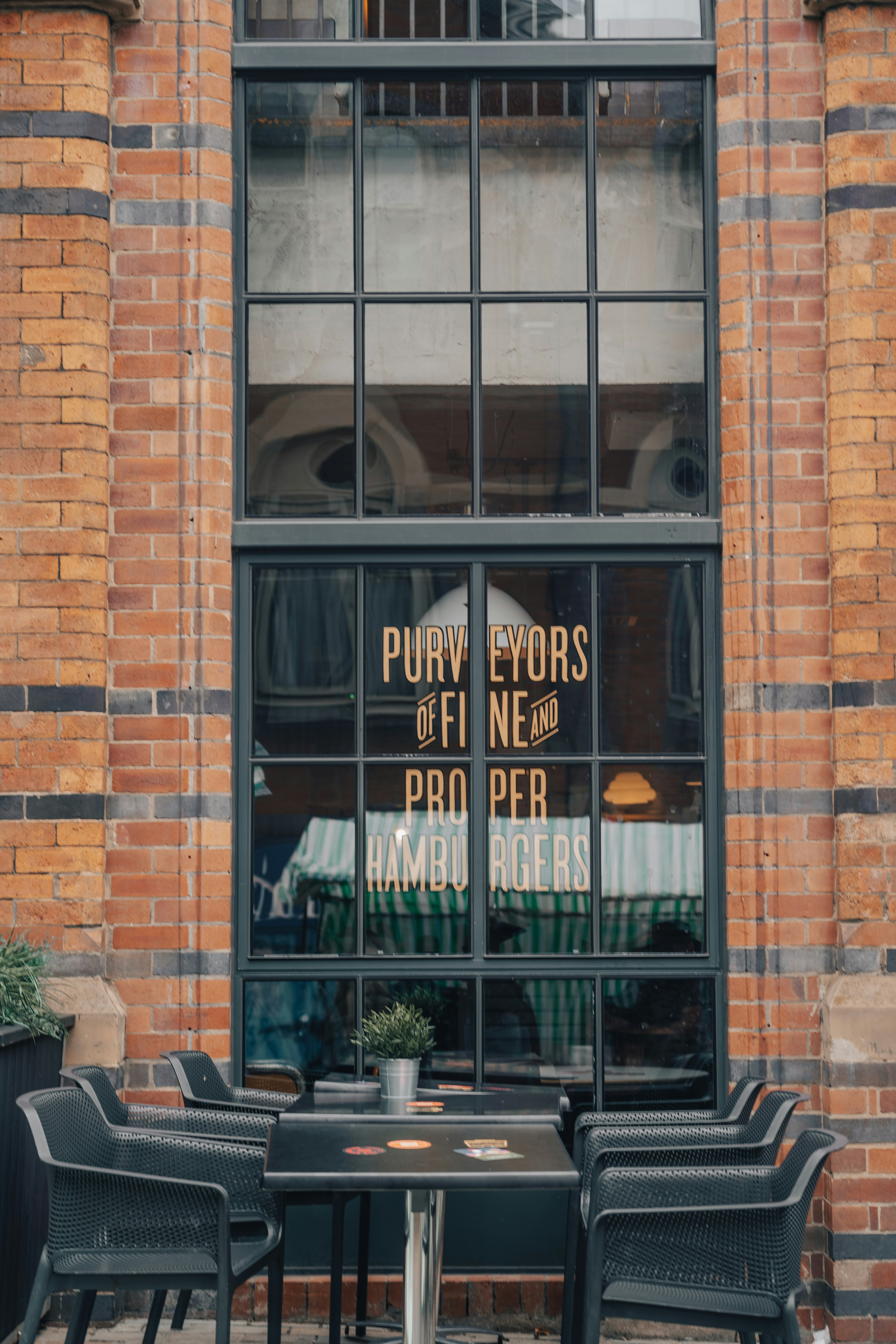 brown brick building with glass window